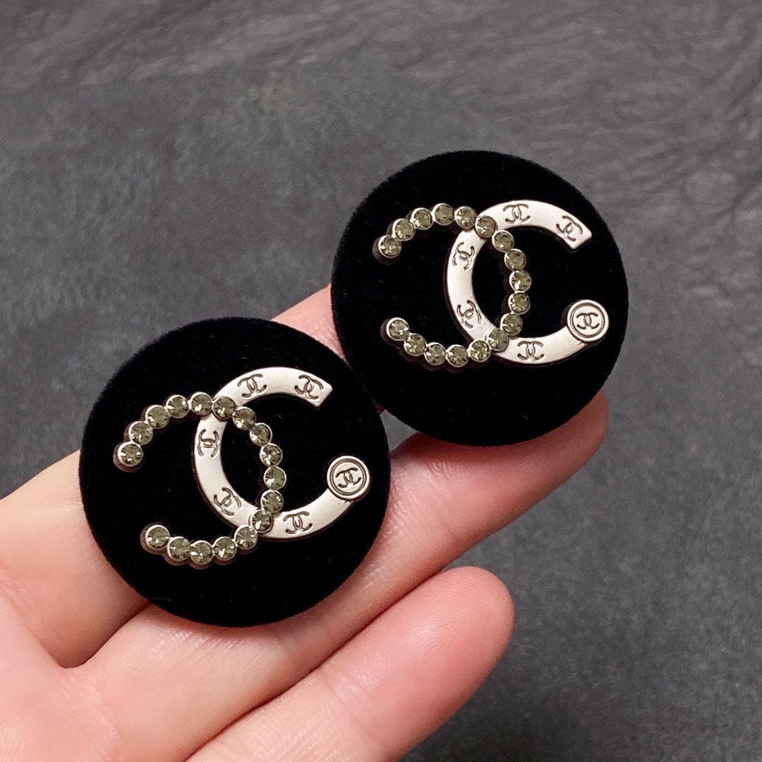 Chanel Black Resin Circle Earrings - 18K Yellow Gold